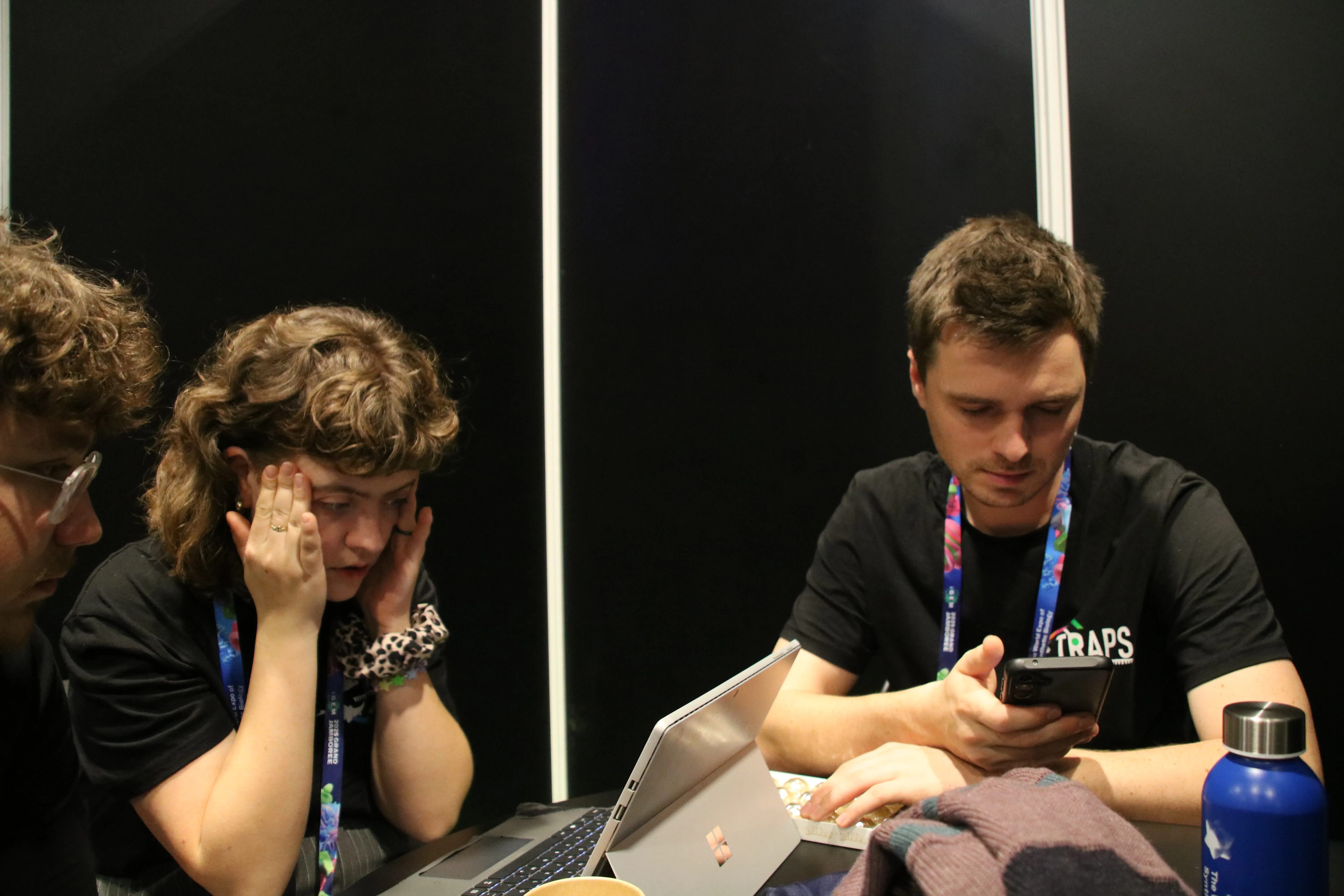 TRAPS members sitting in front of their laptops, preparing for the judging session.