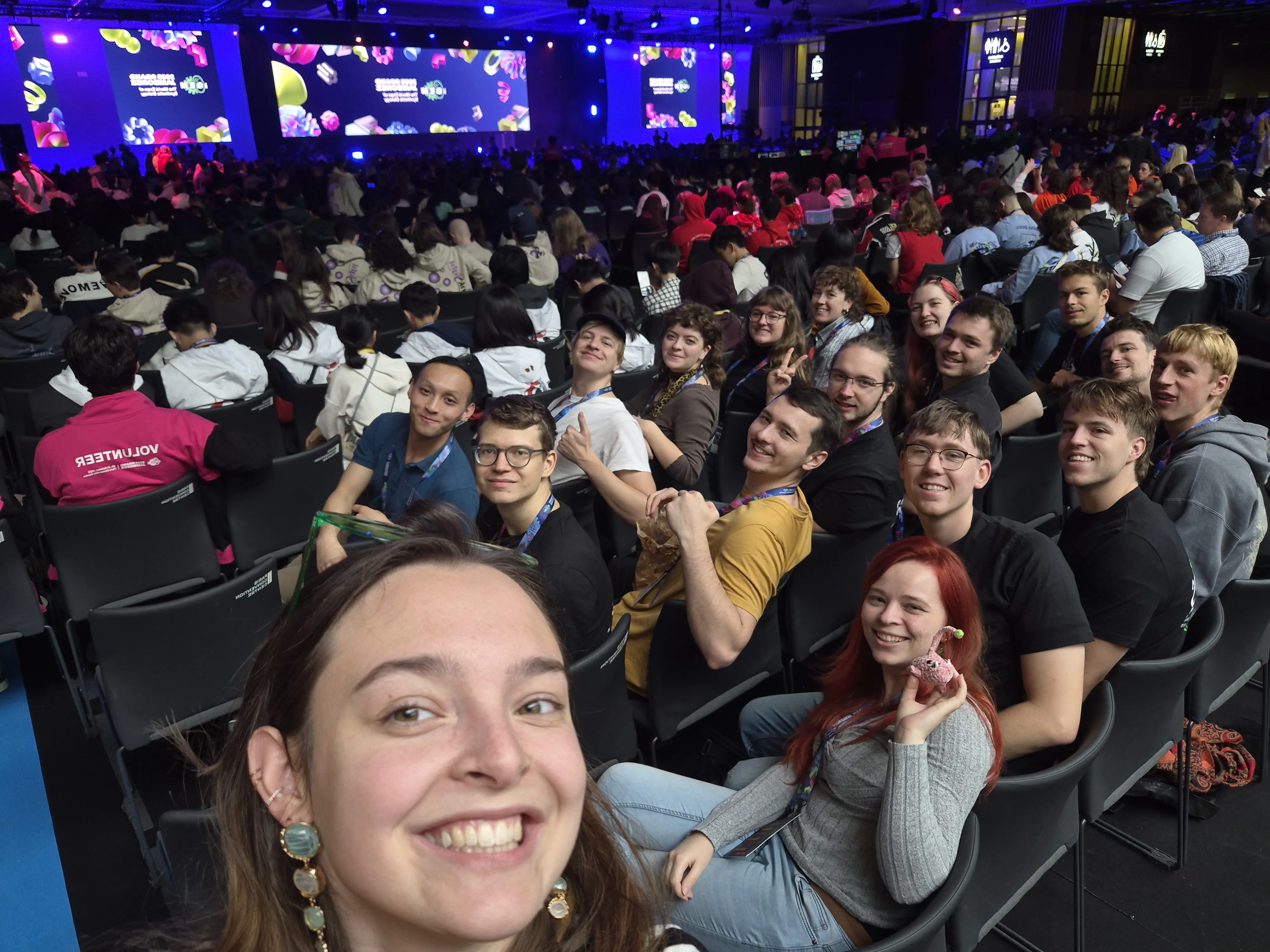TRAPS sitting in front of the stage, smiling