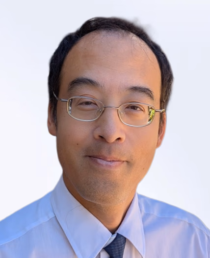 Headshot of Wilfred Tang.