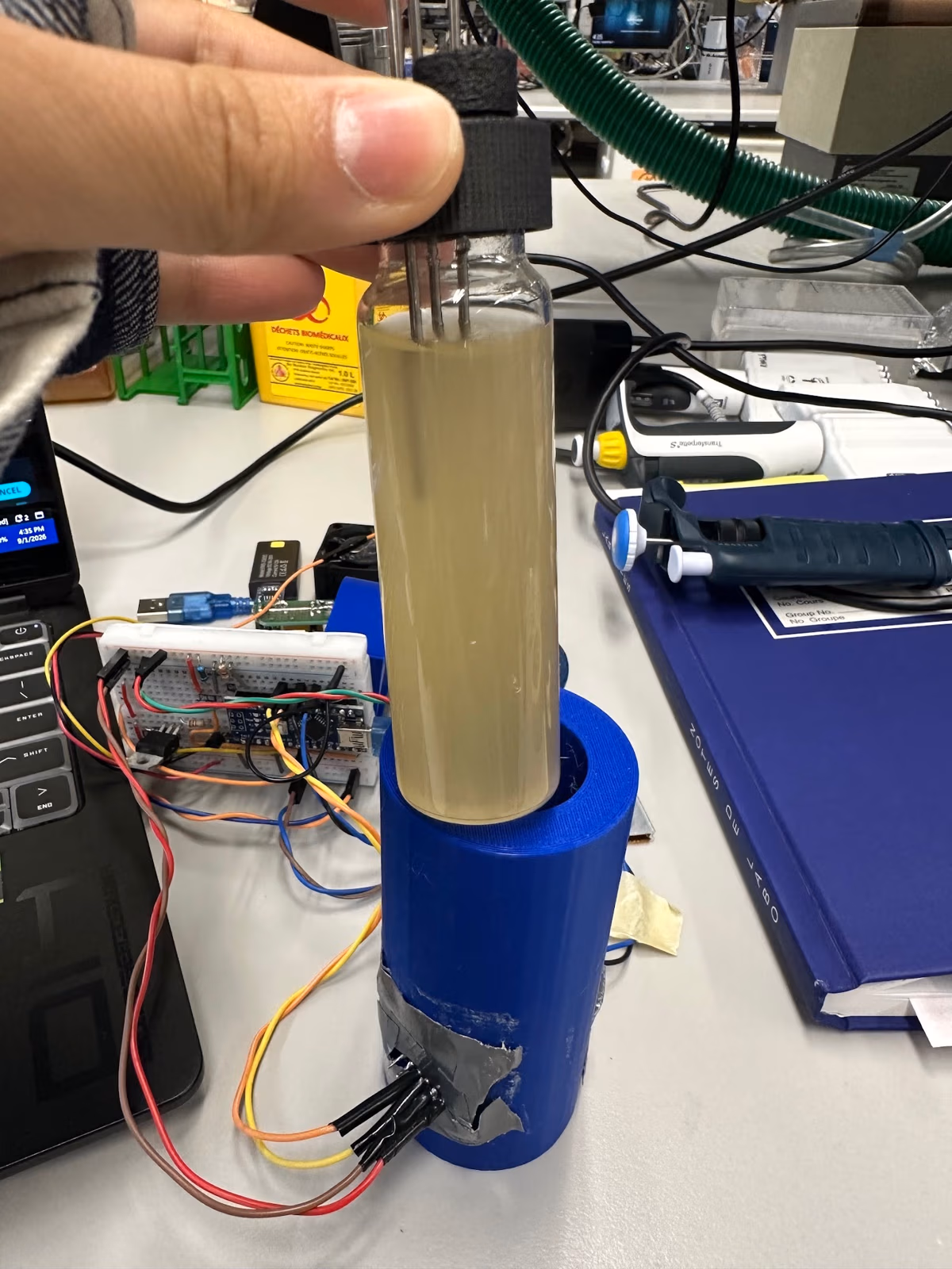 Culture vial beside the bioreactor