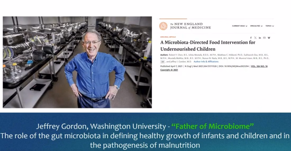 Jeffrey Gordon photographed in his laboratory beside the New England Journal of Medicine paper on a microbiota-directed food intervention for undernourished children.